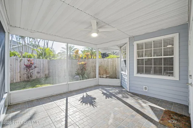 a view of a house with swimming pool and sitting area