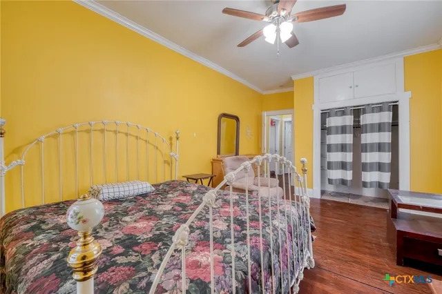 a bedroom with a bed and a walk in closet