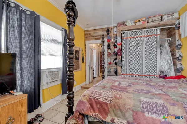 a bed room with a bed and a window