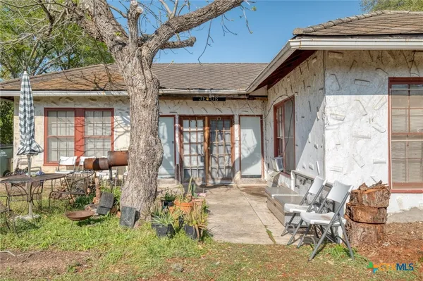 a front view of house with outdoor seating