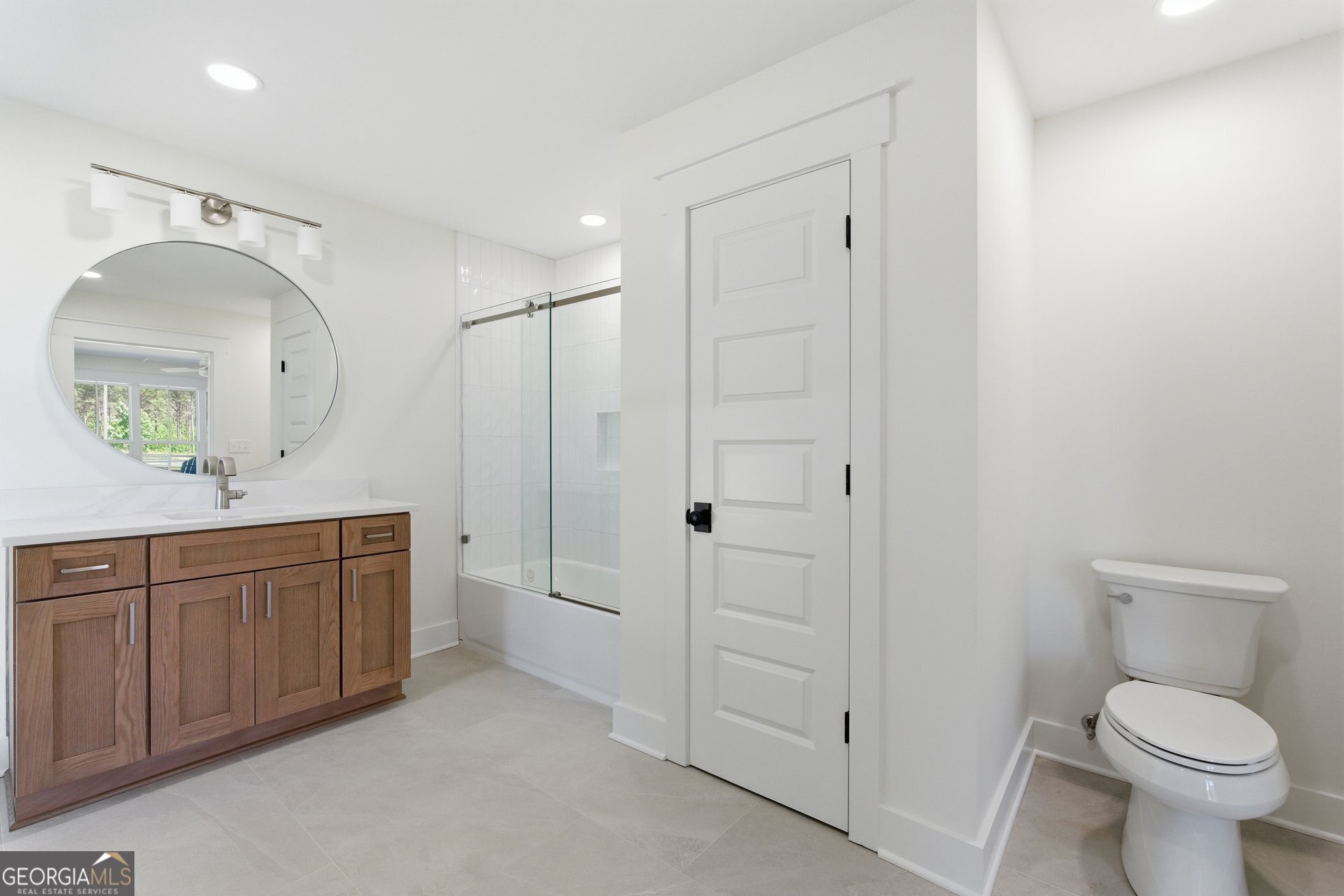 5938 Ridgeway Road Franklin, GA 30217 - Photo 27 of 41 a bathroom with a granite countertop sink toilet and shower
