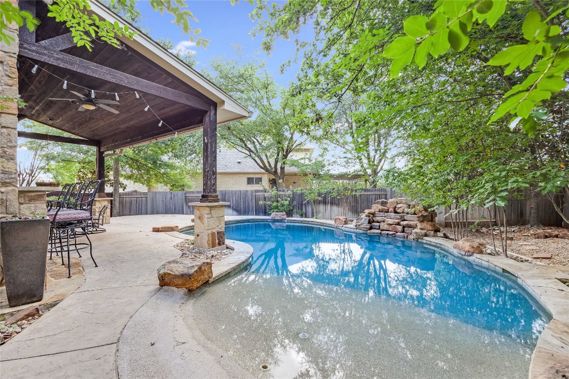 a view of a patio with swimming pool