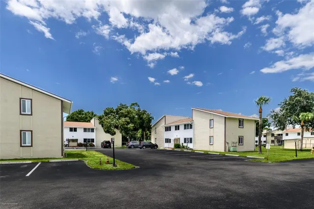 a view of a house with a yard and garage