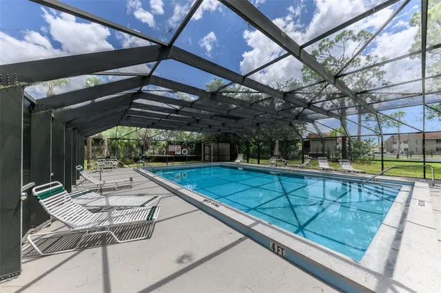 a view of swimming pool with seating area