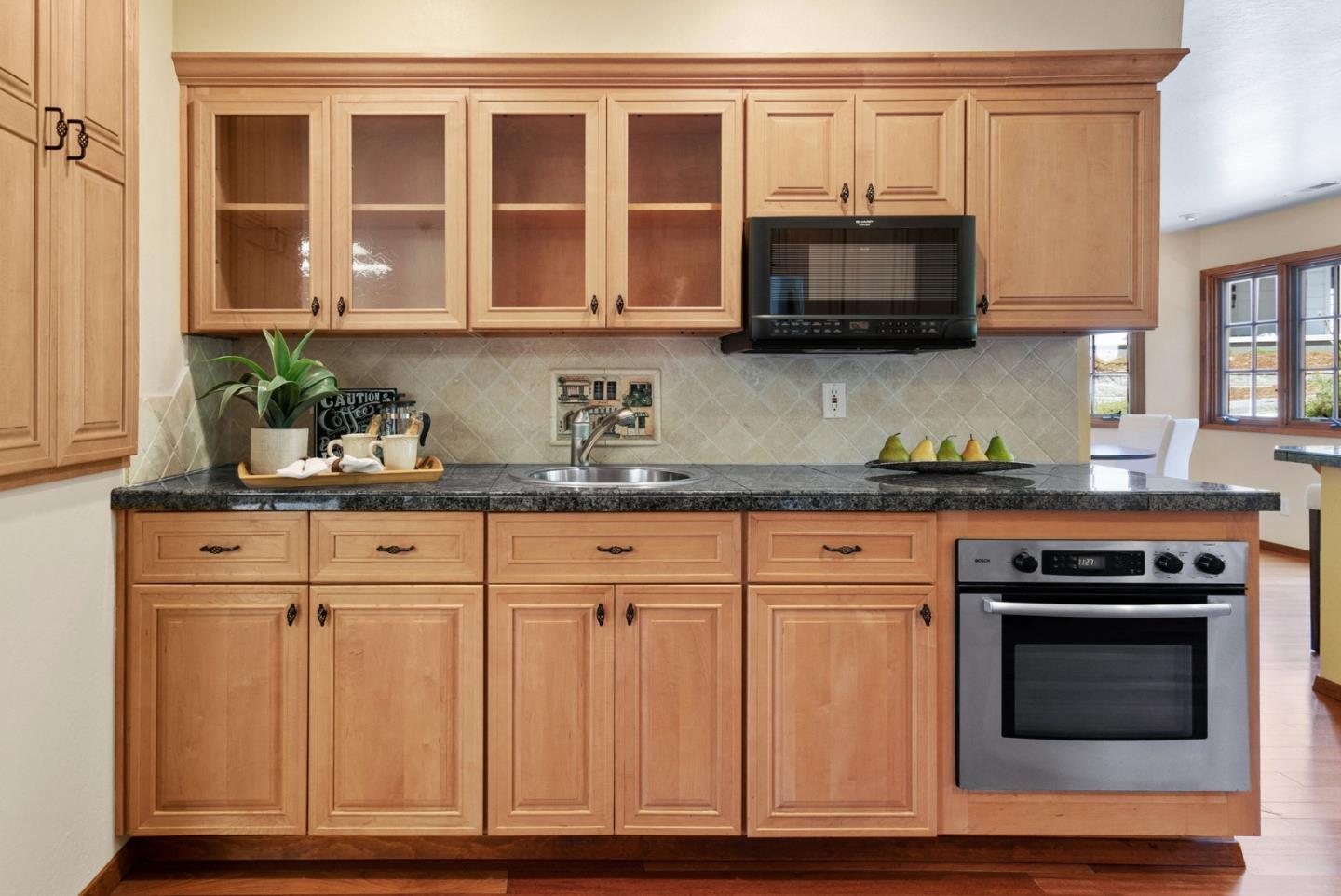 380 Sims Road Santa Cruz, CA 95060 - Photo 12 of 72 a kitchen with stainless steel appliances granite countertop a stove and a microwave