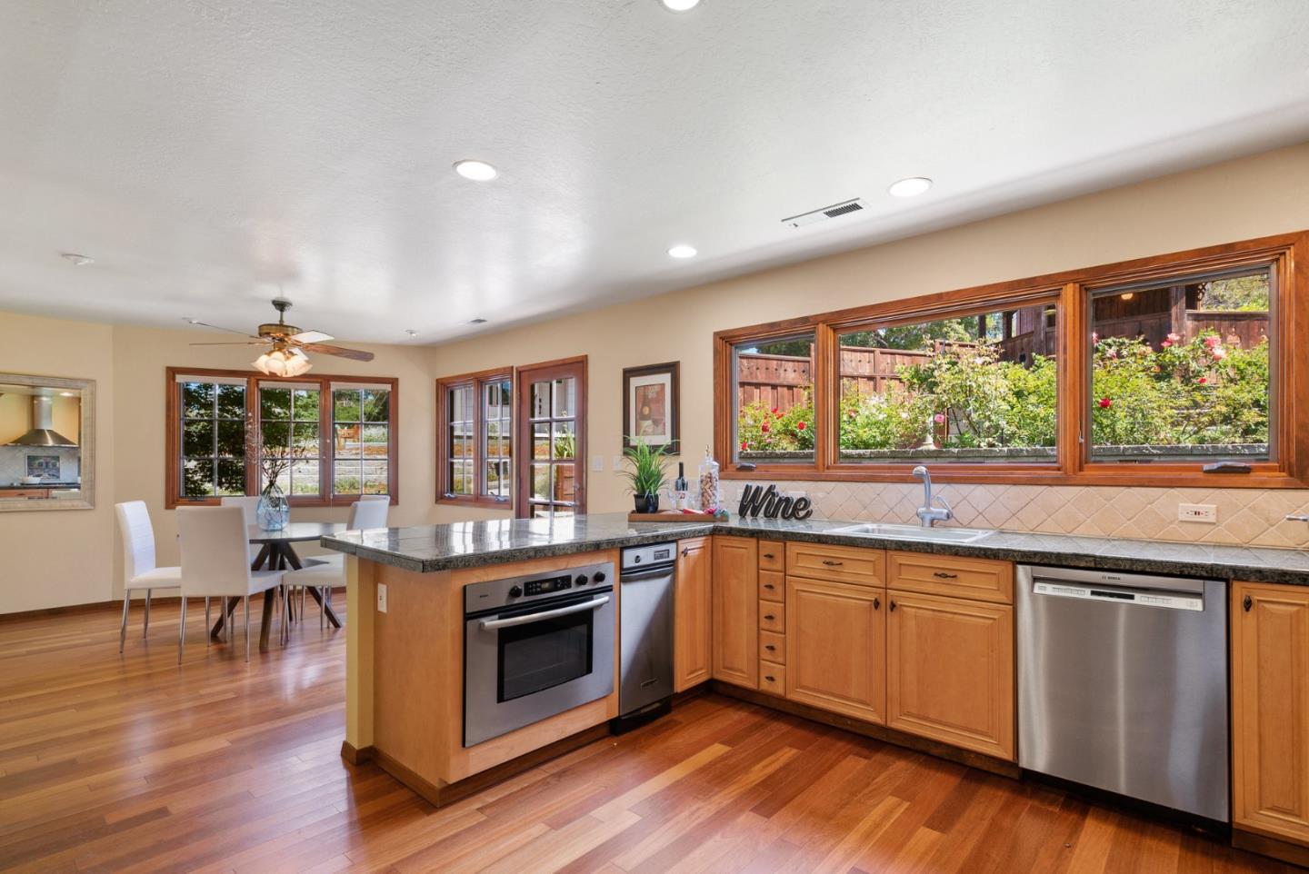 380 Sims Road Santa Cruz, CA 95060 - Photo 14 of 72 a open kitchen with granite countertop a stove top oven sink and wooden floor