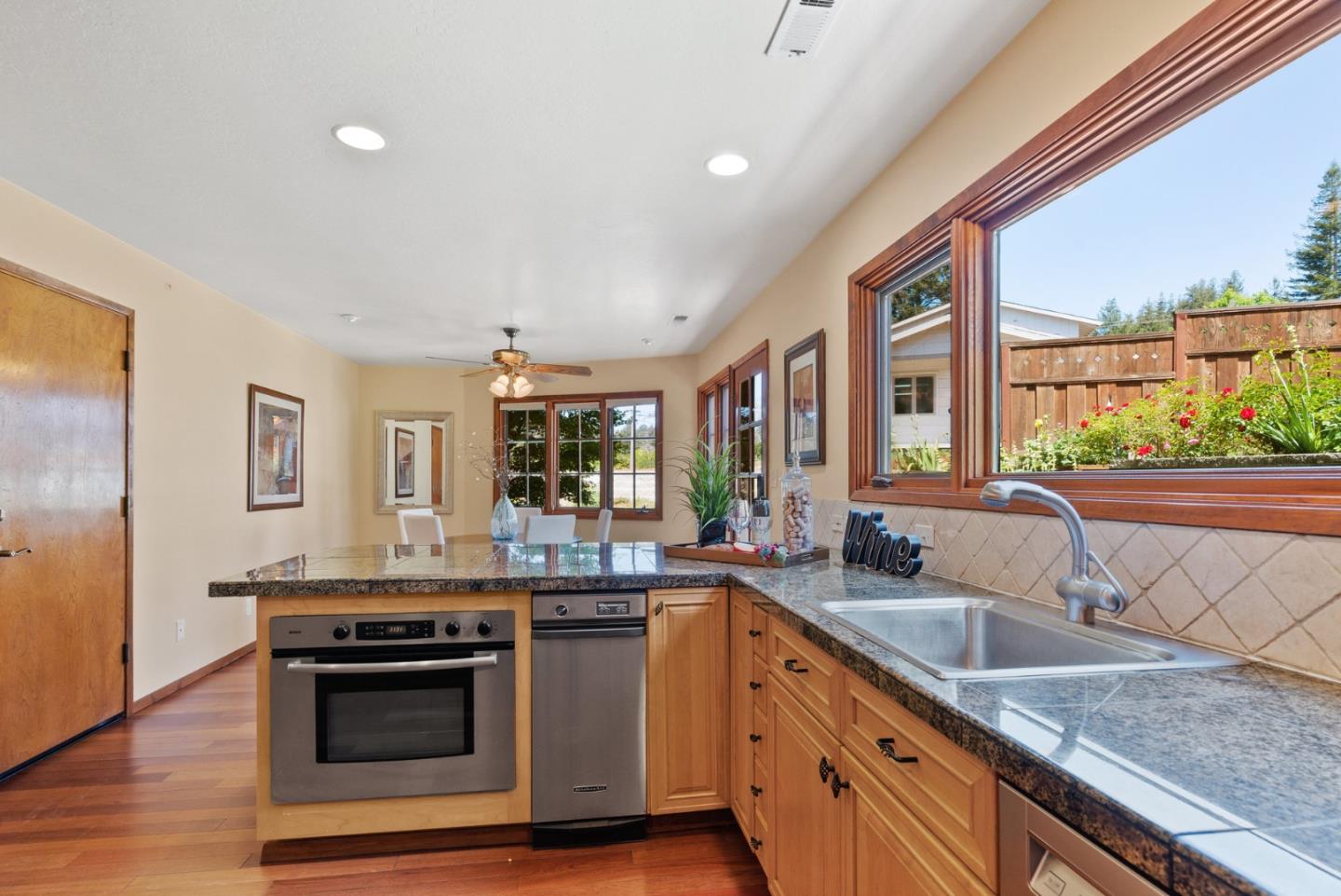 380 Sims Road Santa Cruz, CA 95060 - Photo 17 of 72 a kitchen with stainless steel appliances granite countertop a sink and a stove