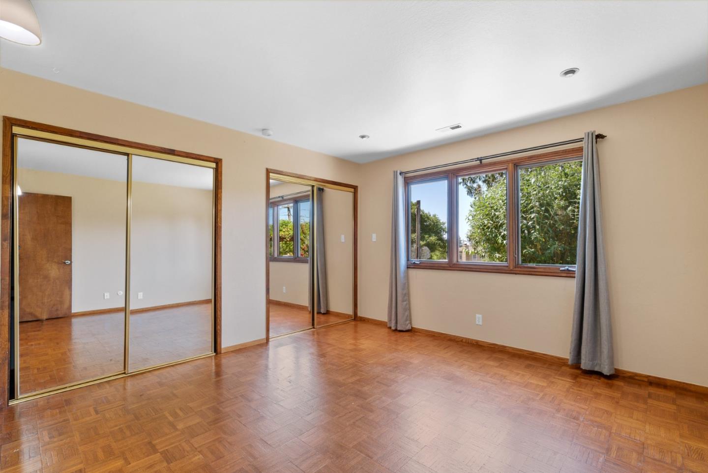380 Sims Road Santa Cruz, CA 95060 - Photo 40 of 72 a view of an empty room with glass door and a window