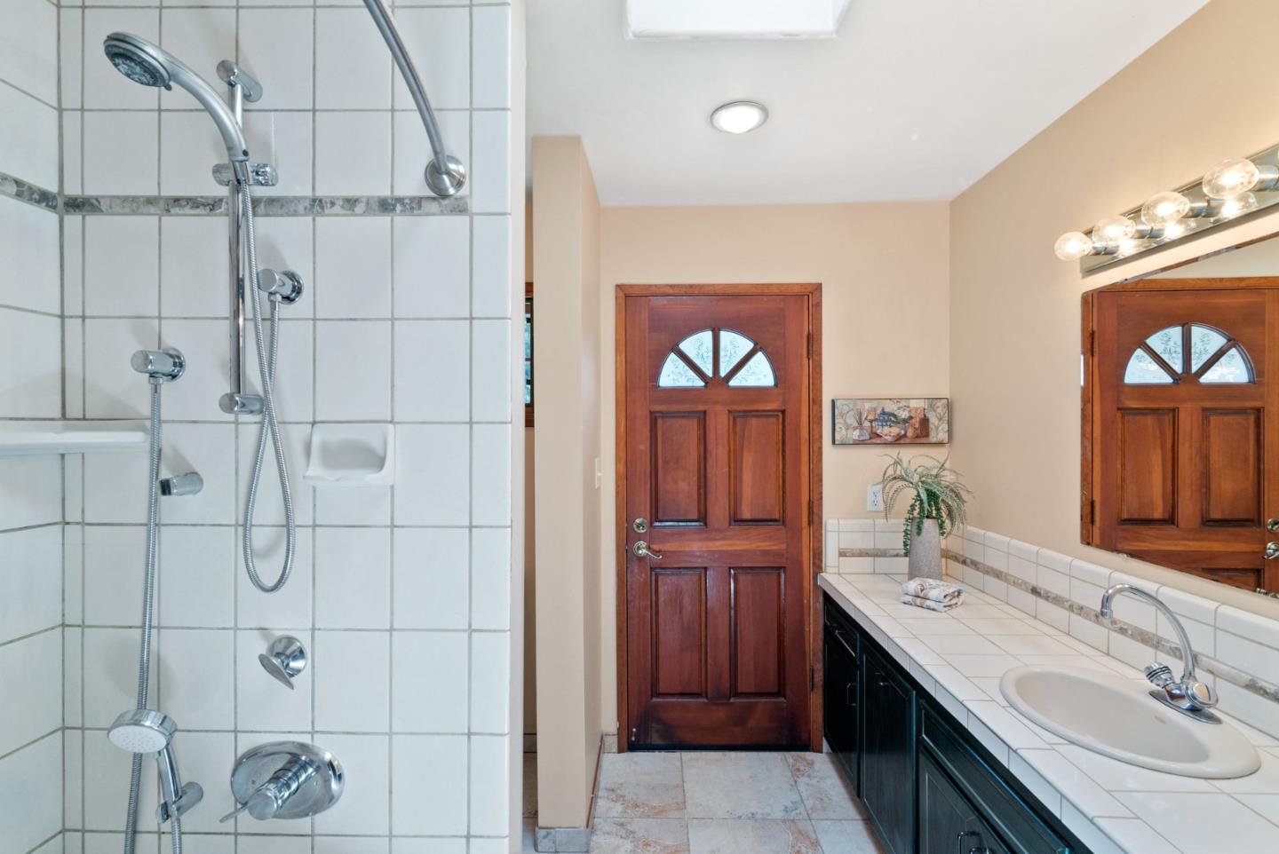 380 Sims Road Santa Cruz, CA 95060 - Photo 42 of 72 a bathroom with a sink a vanity and a mirror