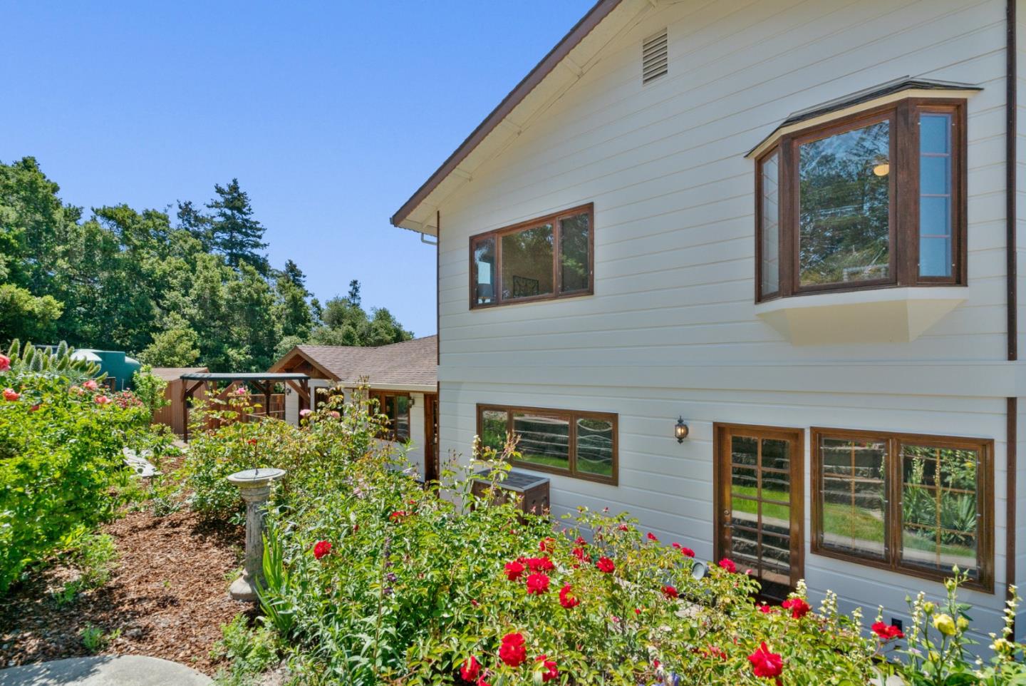 380 Sims Road Santa Cruz, CA 95060 - Photo 48 of 72 a flower garden is sitting in front of a house