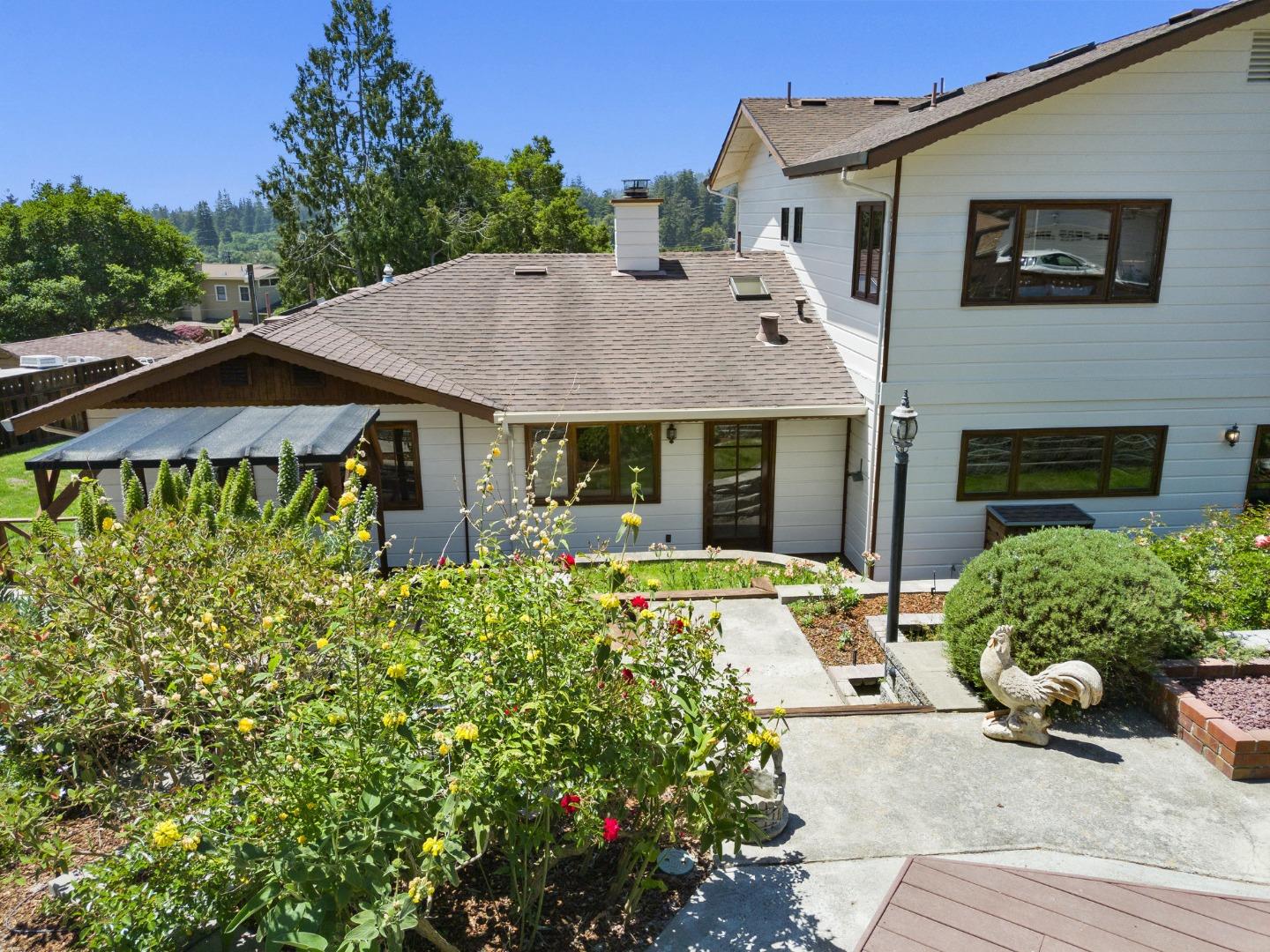 380 Sims Road Santa Cruz, CA 95060 - Photo 57 of 72 a front view of a house with a garden and plants