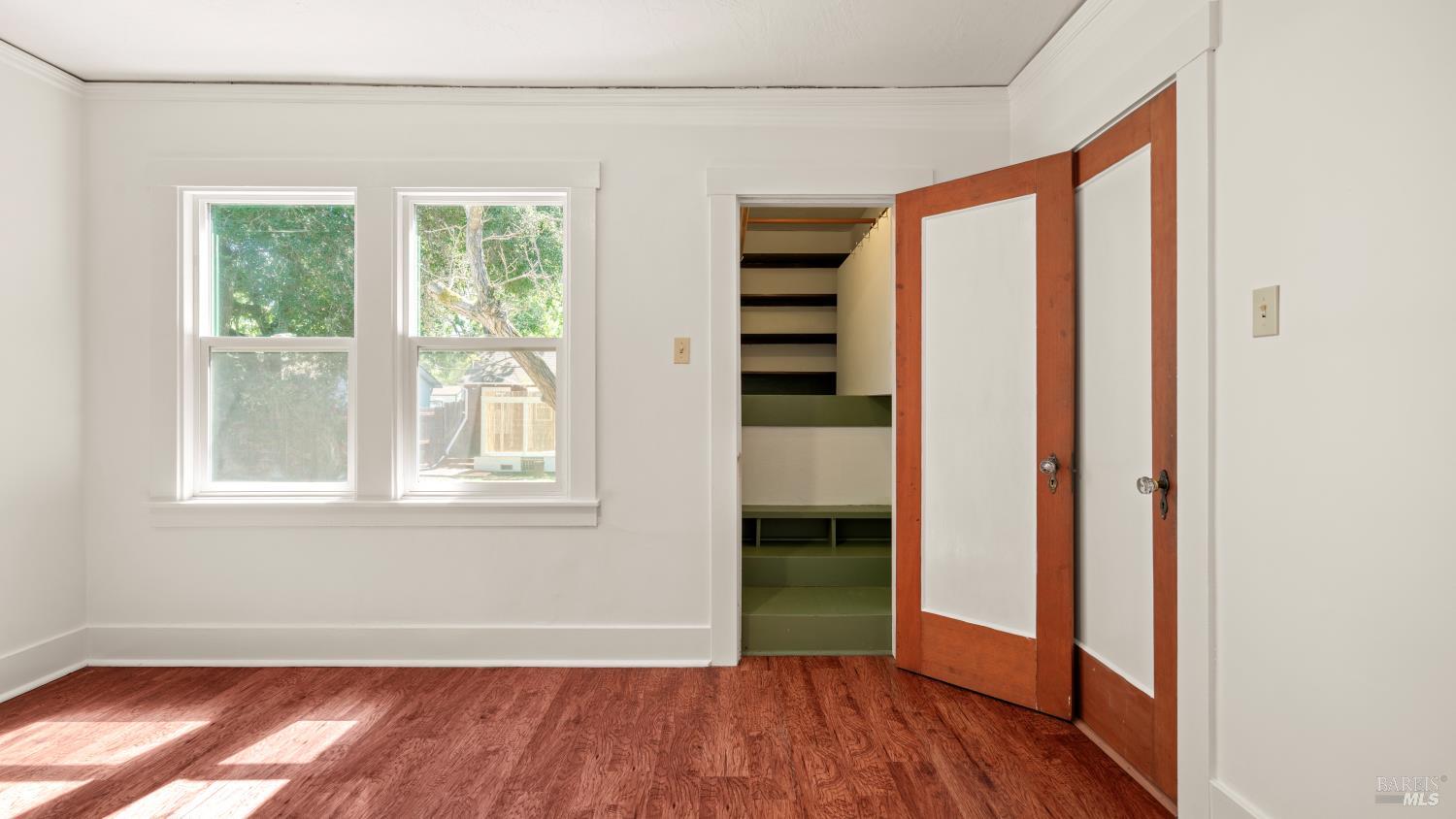 1160 Carr Avenue Santa Rosa, CA 95404 - Photo 31 of 56 an empty room with wooden floor and windows