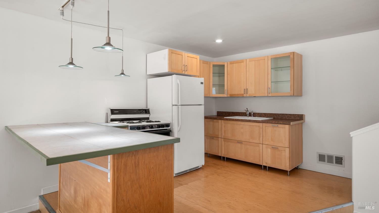 1160 Carr Avenue Santa Rosa, CA 95404 - Photo 35 of 56 a kitchen with a stove a refrigerator and a sink