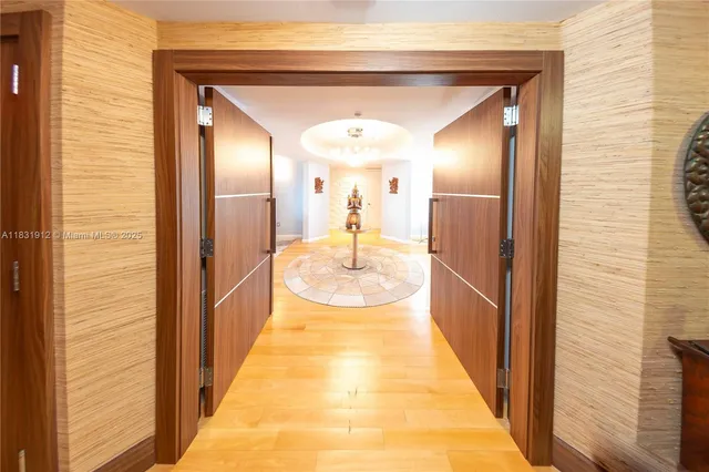 a view of a bathroom with mirror and shower