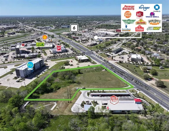 a view of a pool with plants and outdoor seating