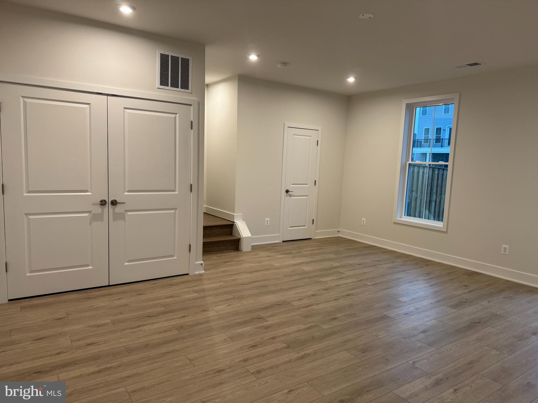 112 Galaxy Place Stephenson, VA 22656 - Photo 11 of 31 an empty room with wooden floor and cabinet
