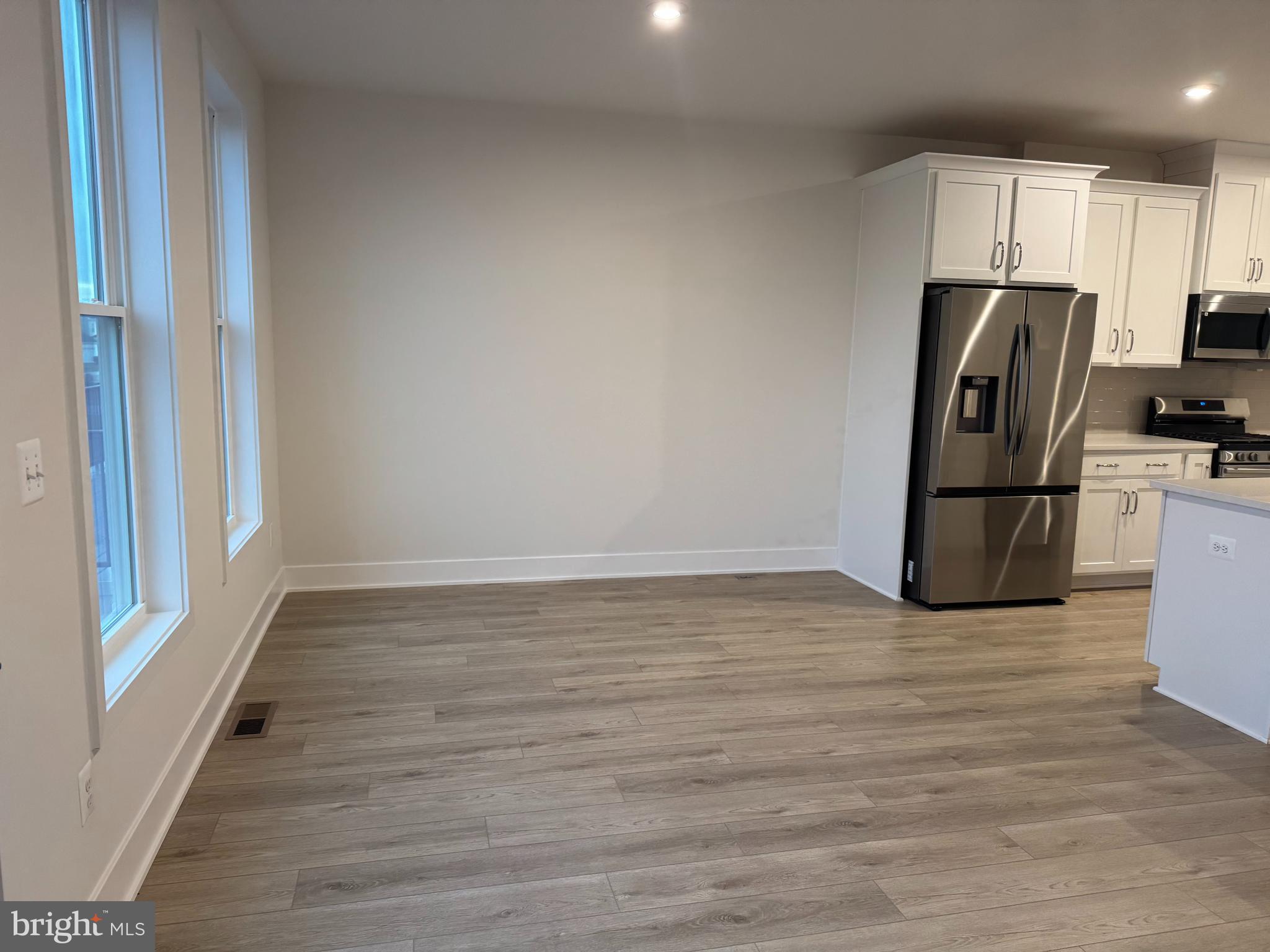 112 Galaxy Place Stephenson, VA 22656 - Photo 12 of 31 a view of a refrigerator in kitchen and wooden floor