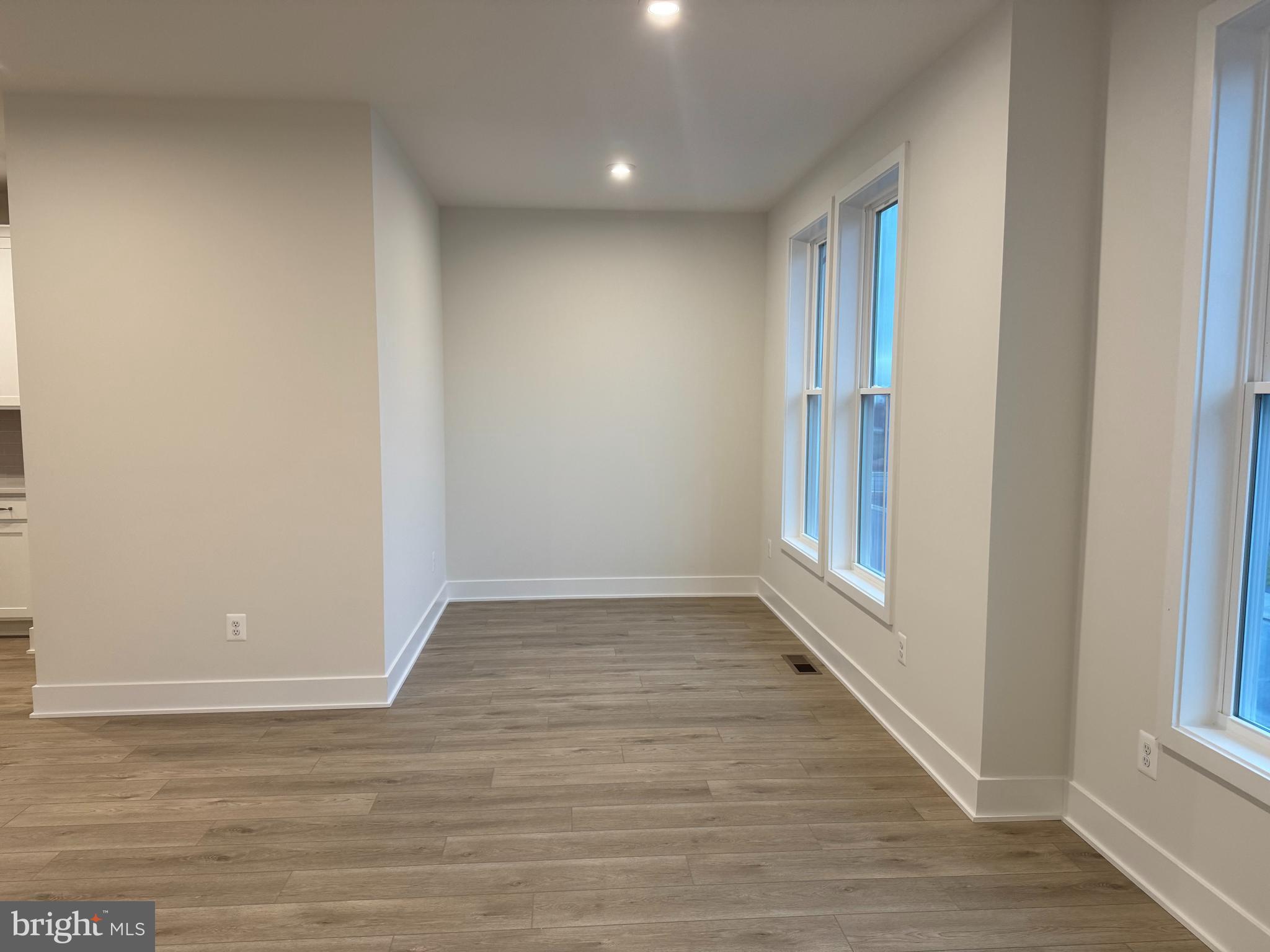 112 Galaxy Place Stephenson, VA 22656 - Photo 13 of 31 a view of an empty room with wooden floor and a window