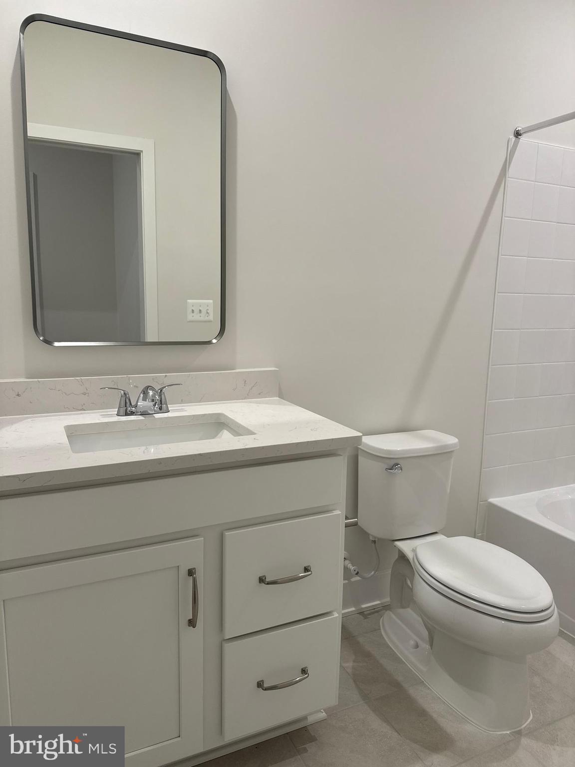 112 Galaxy Place Stephenson, VA 22656 - Photo 22 of 31 a bathroom with a granite countertop toilet sink and mirror