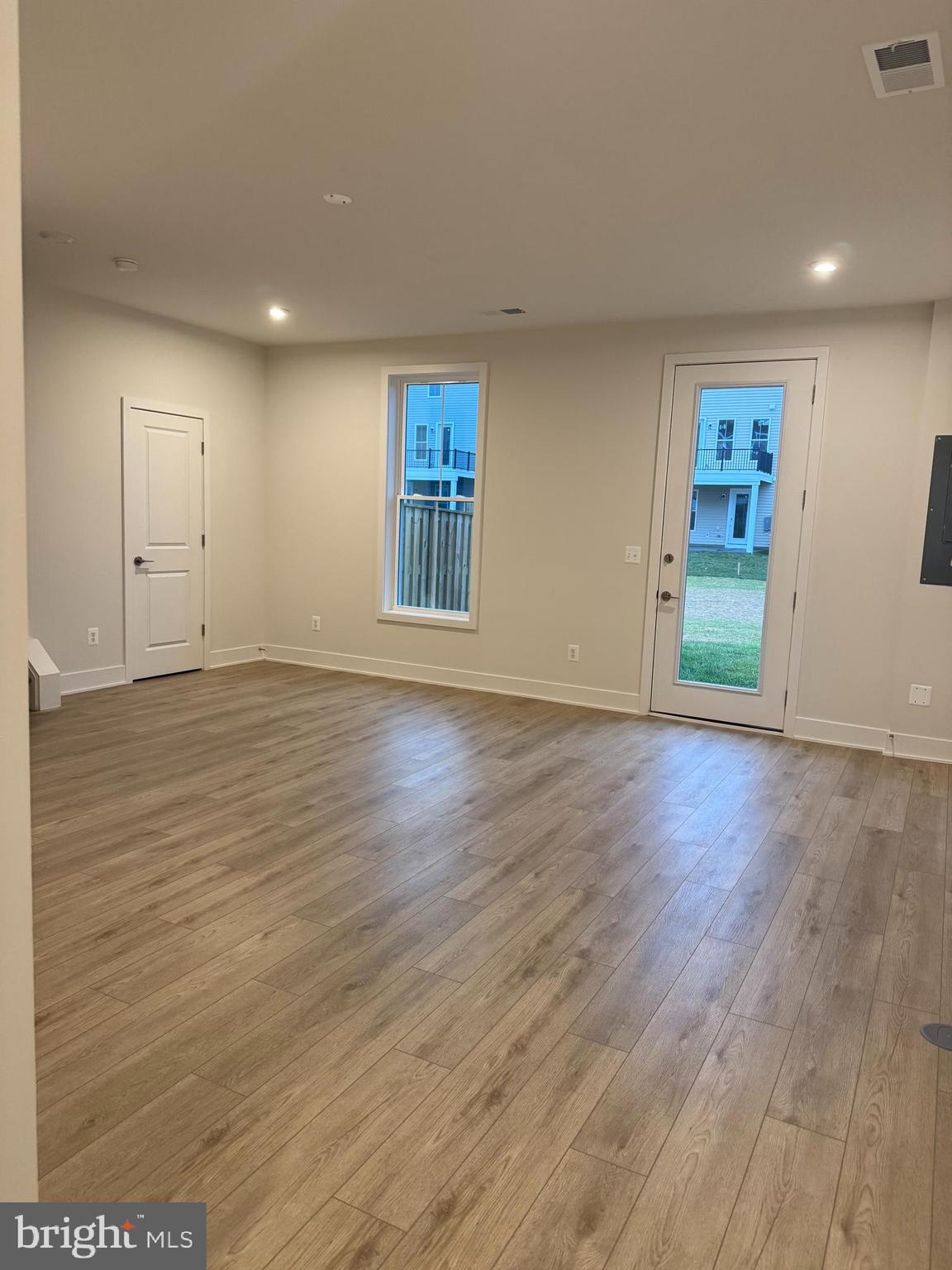 112 Galaxy Place Stephenson, VA 22656 - Photo 25 of 31 a view of an empty room with wooden floor and a window