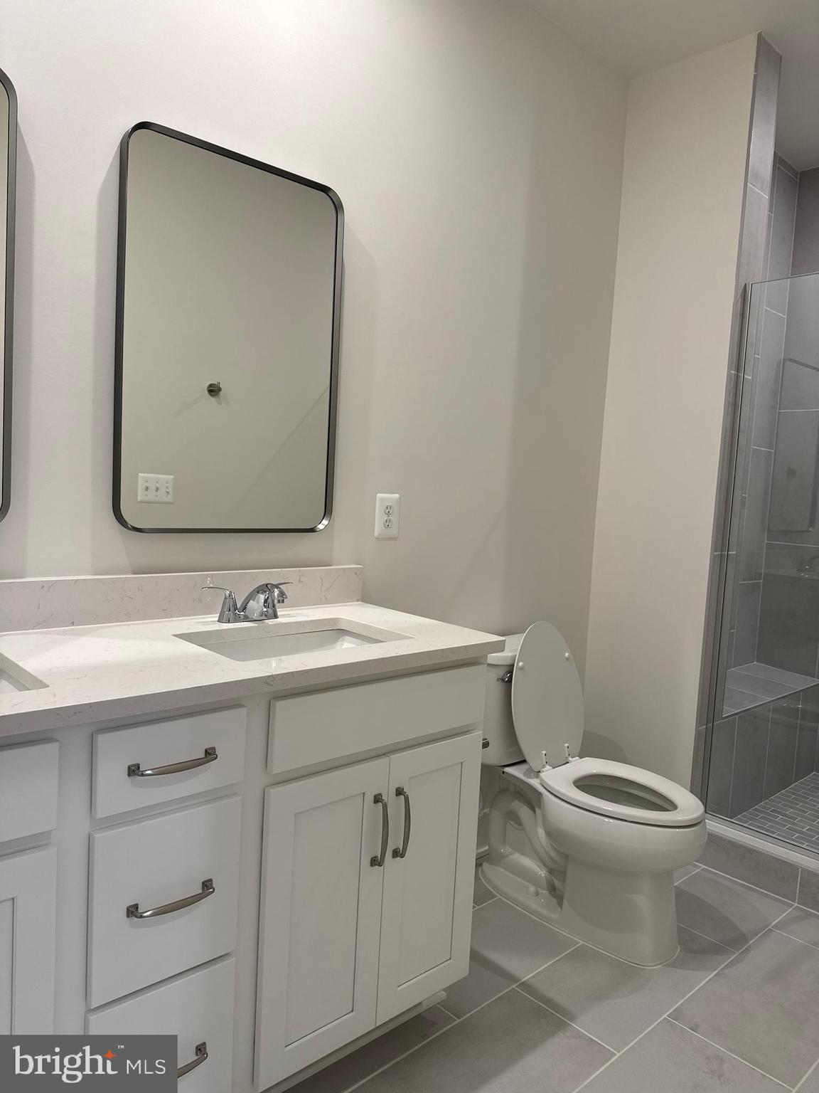 112 Galaxy Place Stephenson, VA 22656 - Photo 26 of 31 a bathroom with a toilet sink and mirror