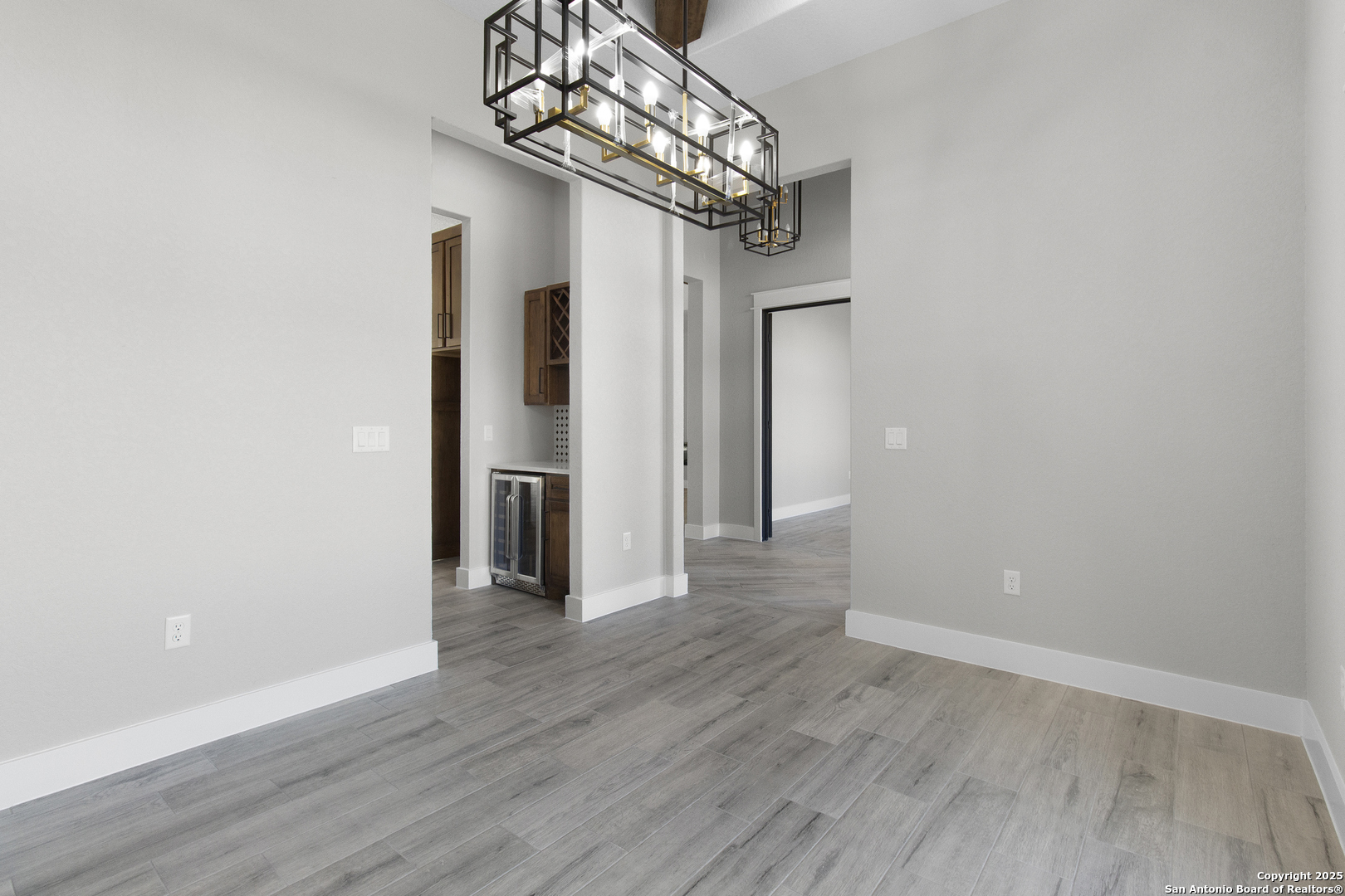 116 Western Way Adkins, TX 78101 - Photo 16 of 50 a view of a hallway with wooden floor