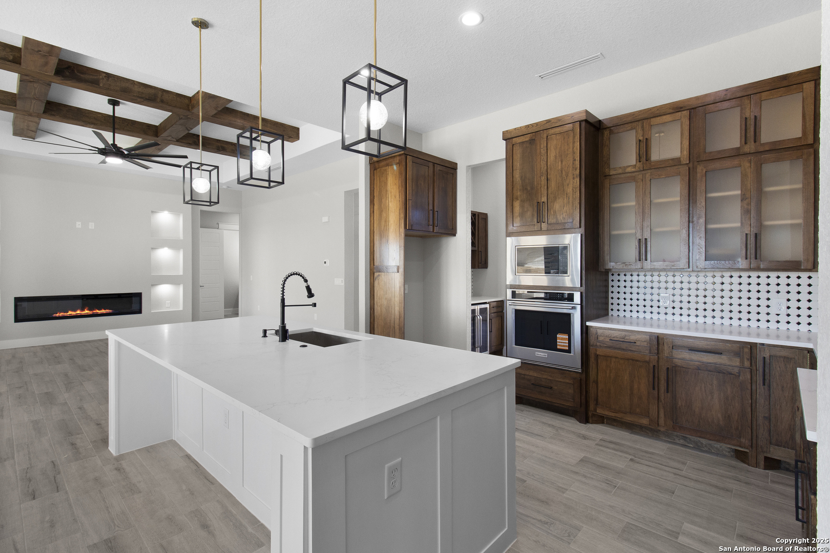 116 Western Way Adkins, TX 78101 - Photo 19 of 50 a kitchen that has a kitchen island wooden cabinets and stainless steel appliances