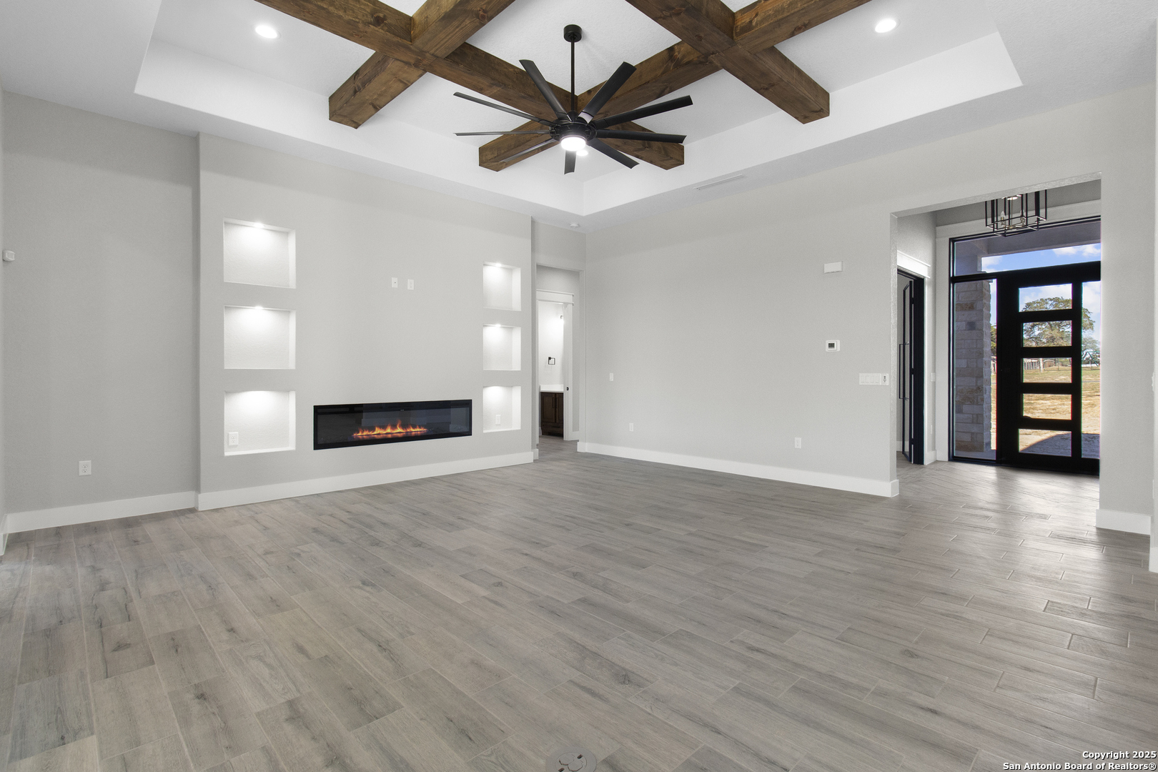 116 Western Way Adkins, TX 78101 - Photo 21 of 50 a view of an empty room with window and wooden floor