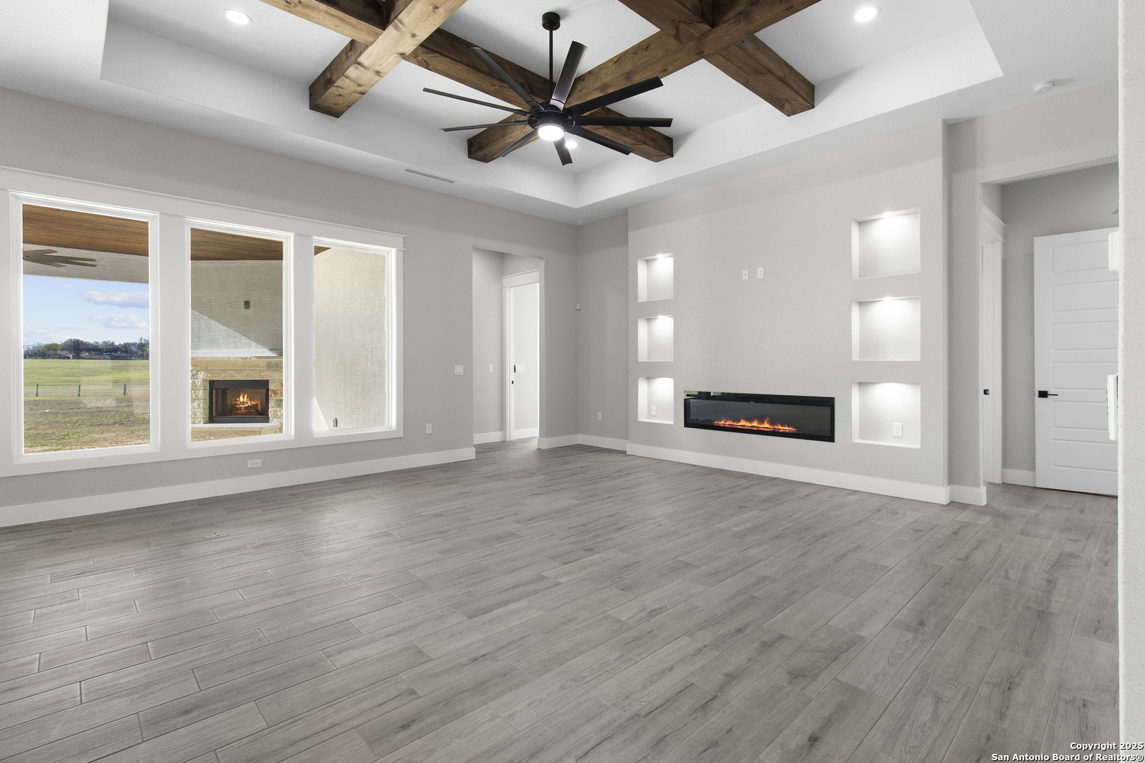 116 Western Way Adkins, TX 78101 - Photo 22 of 50 a view of a livingroom with a ceiling fan and wooden floor