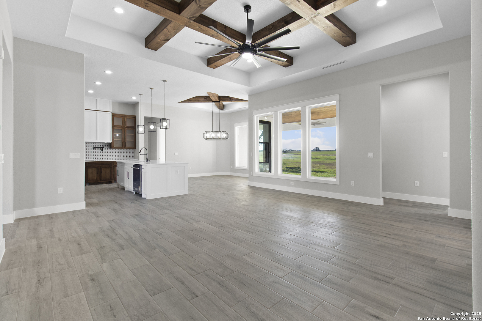 116 Western Way Adkins, TX 78101 - Photo 23 of 50 a view of an empty room with window and wooden floor