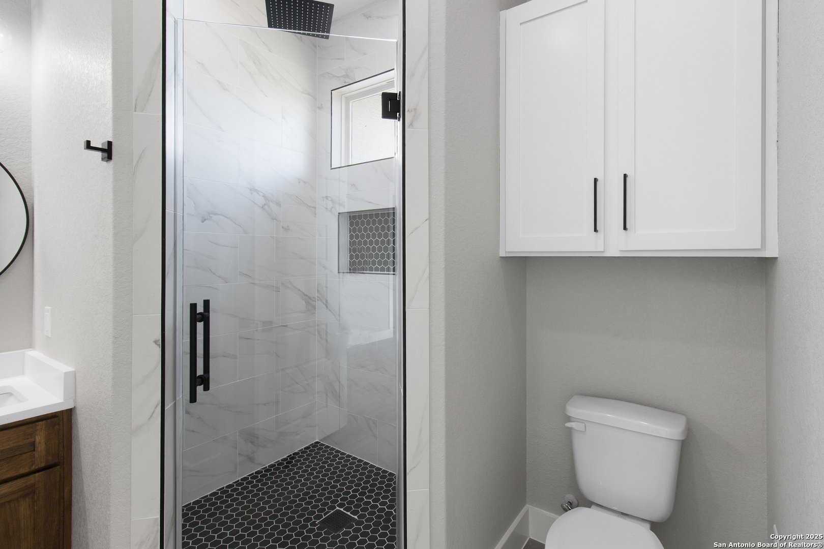 116 Western Way Adkins, TX 78101 - Photo 26 of 50 a bathroom with a toilet and a shower