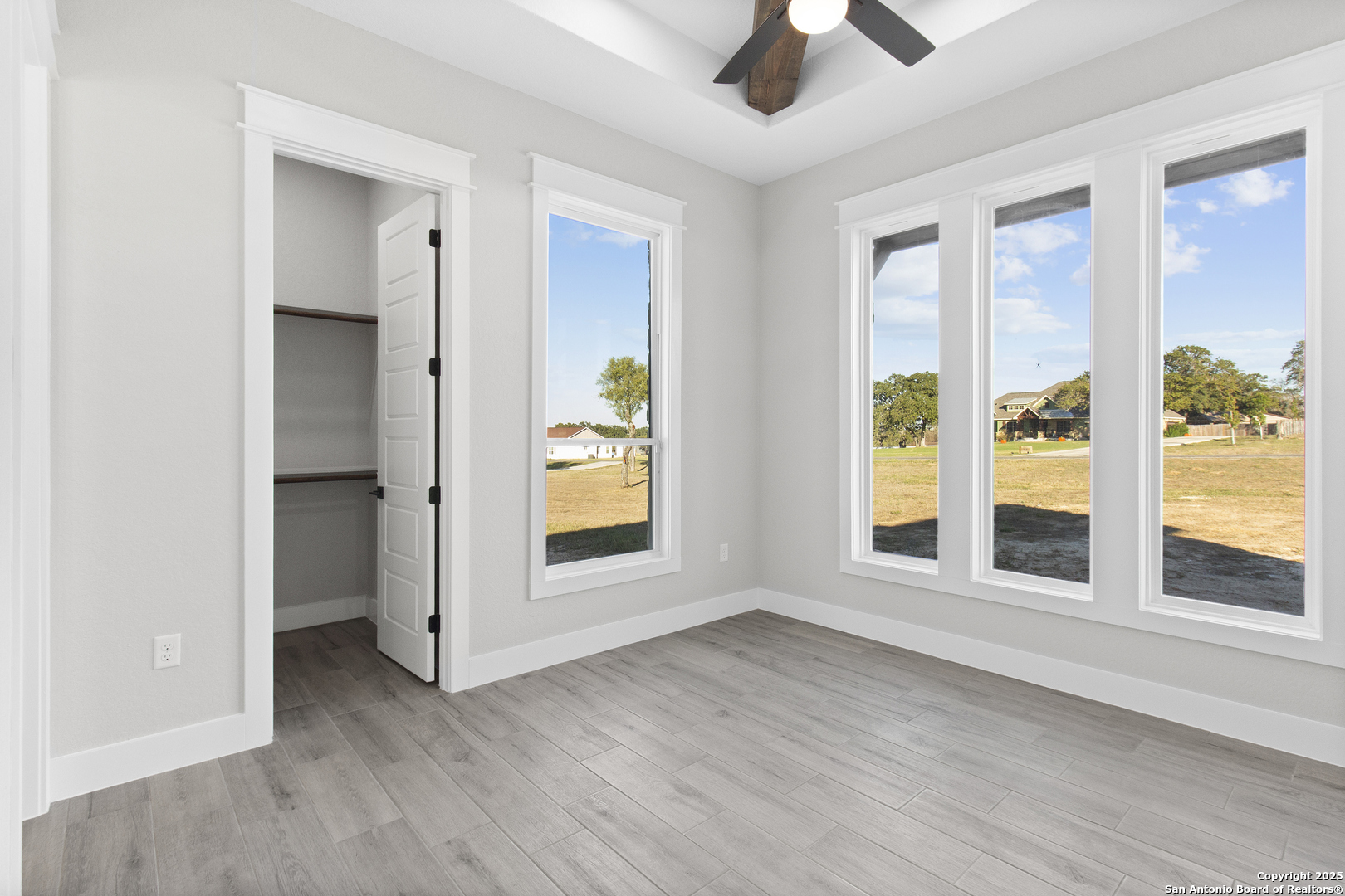 116 Western Way Adkins, TX 78101 - Photo 29 of 50 a view of an empty room with a window and wooden floor
