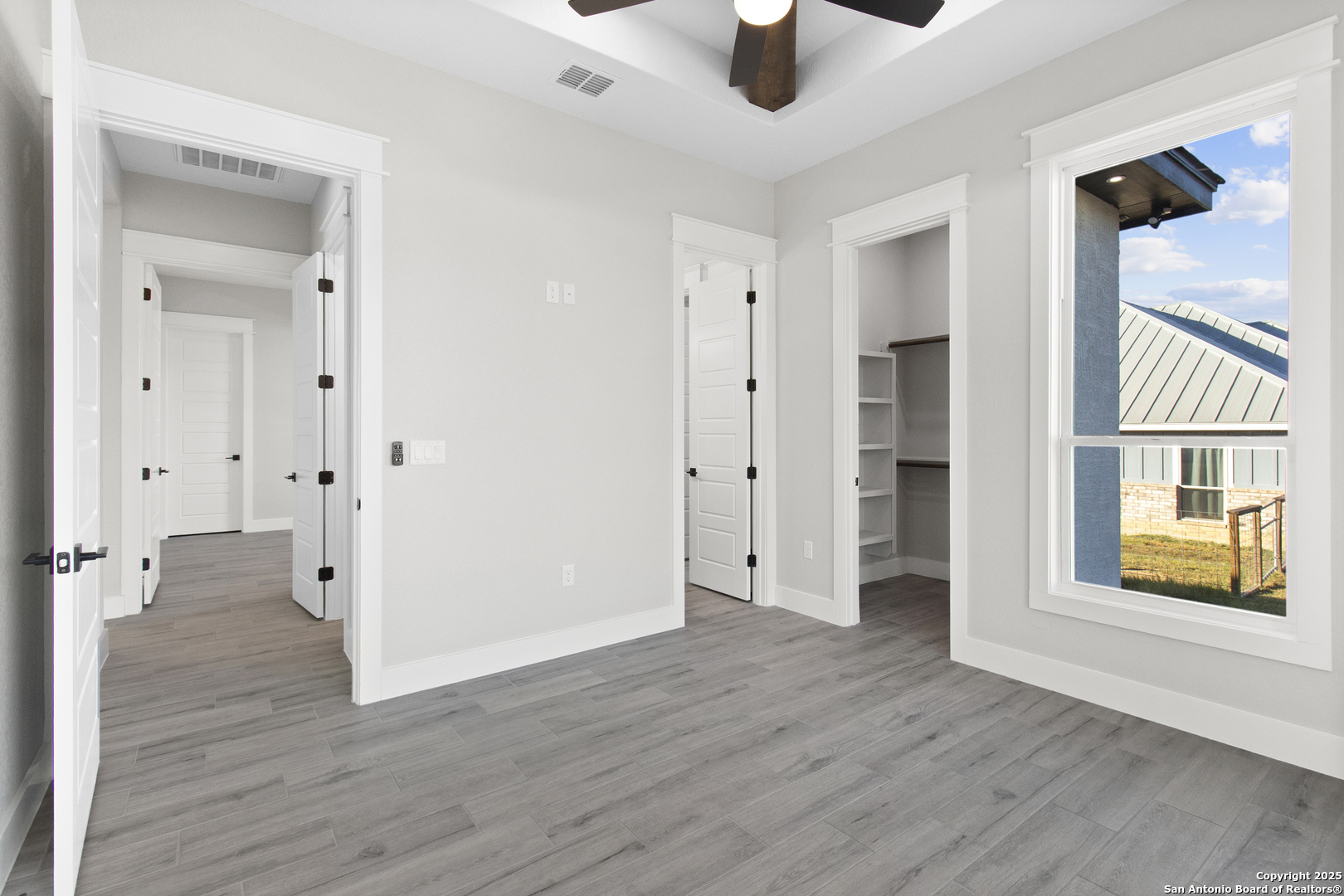 116 Western Way Adkins, TX 78101 - Photo 30 of 50 wooden floor in an empty room with a window