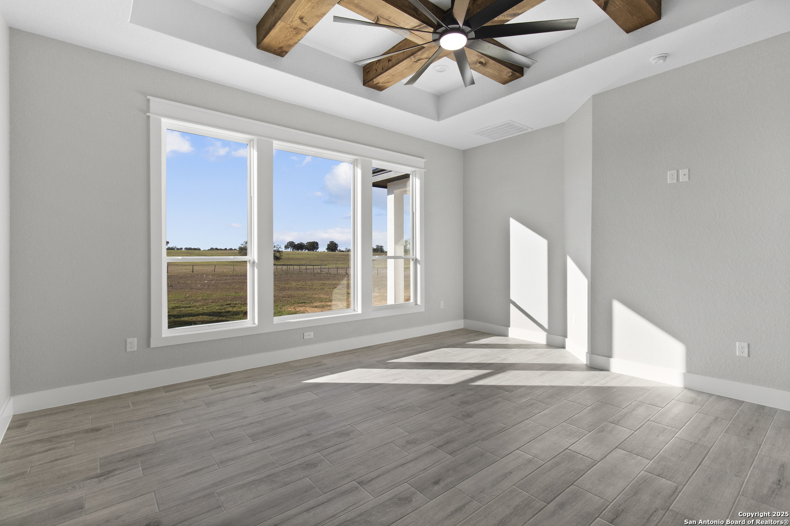 116 Western Way Adkins, TX 78101 - Photo 35 of 50 a view of an empty room with wooden floor and a window