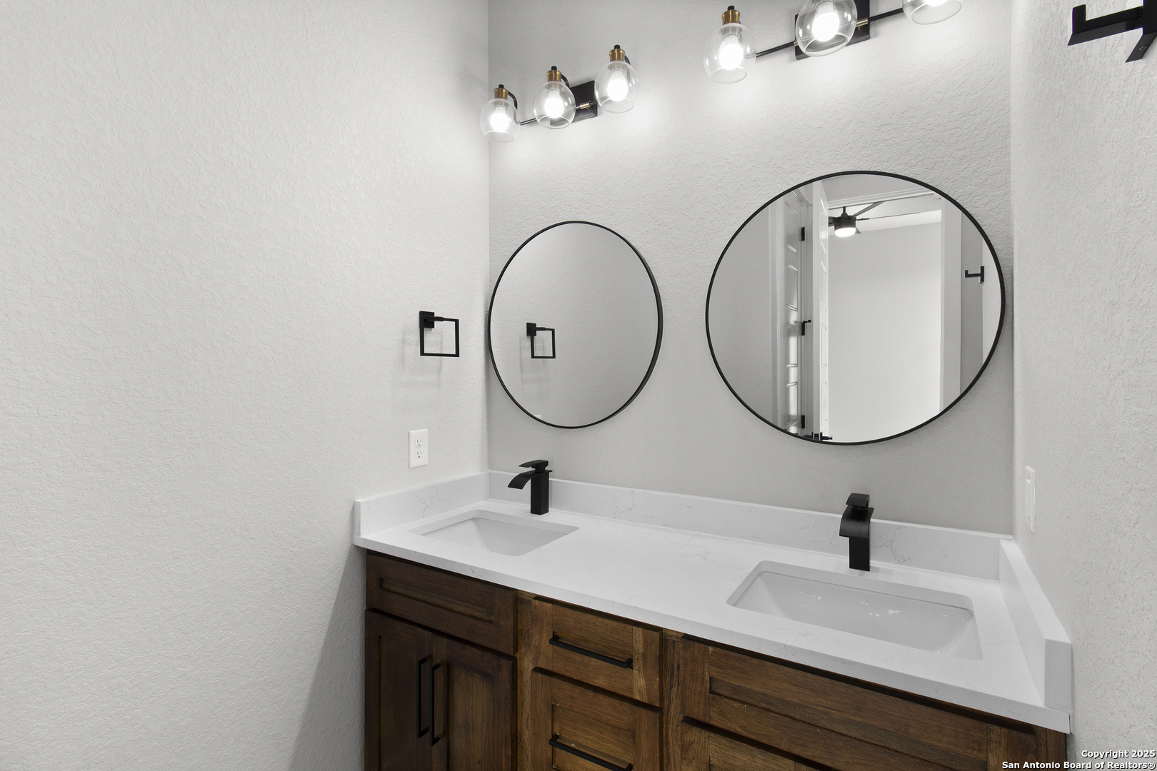 116 Western Way Adkins, TX 78101 - Photo 41 of 50 a bathroom with a sink and a mirror