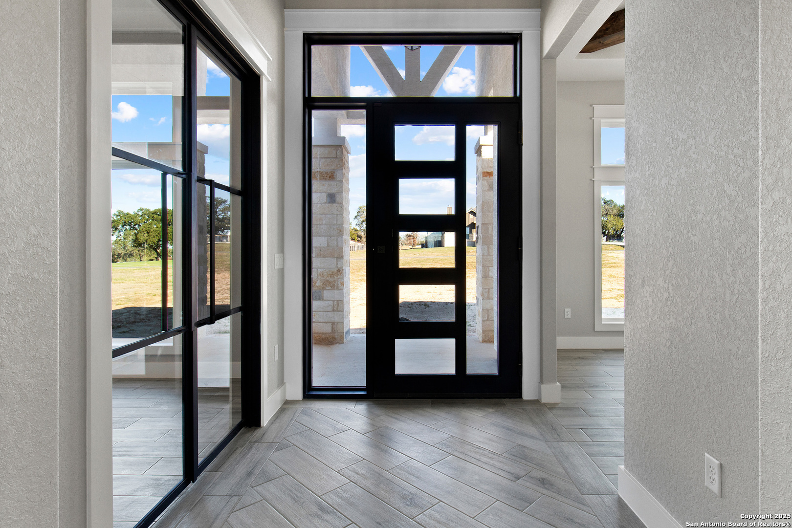 116 Western Way Adkins, TX 78101 - Photo 10 of 50 wooden floor in a room with a window