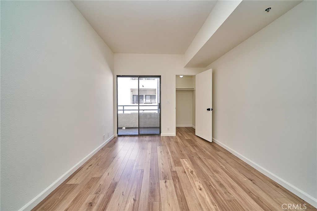720 West 4th Street, Unit 305 Long Beach, CA 90802 - Photo 14 of 52 wooden floor in an empty room with a window