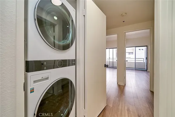 a view of a hallway with washer and dryer