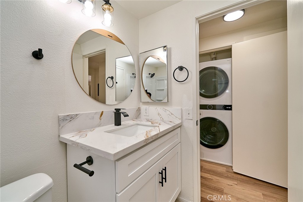 720 West 4th Street, Unit 305 Long Beach, CA 90802 - Photo 18 of 52 a bathroom with a sink and a mirror