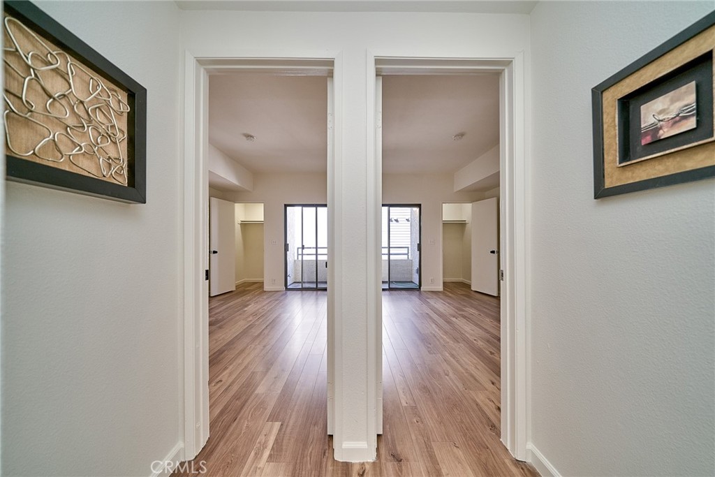 720 West 4th Street, Unit 305 Long Beach, CA 90802 - Photo 19 of 52 a view of a hallway with wooden floor and closet