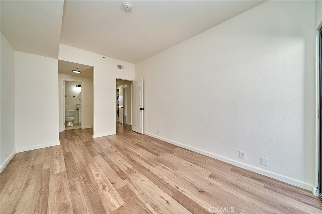 720 West 4th Street, Unit 305 Long Beach, CA 90802 - Photo 25 of 52 a view of an empty room and wooden floor
