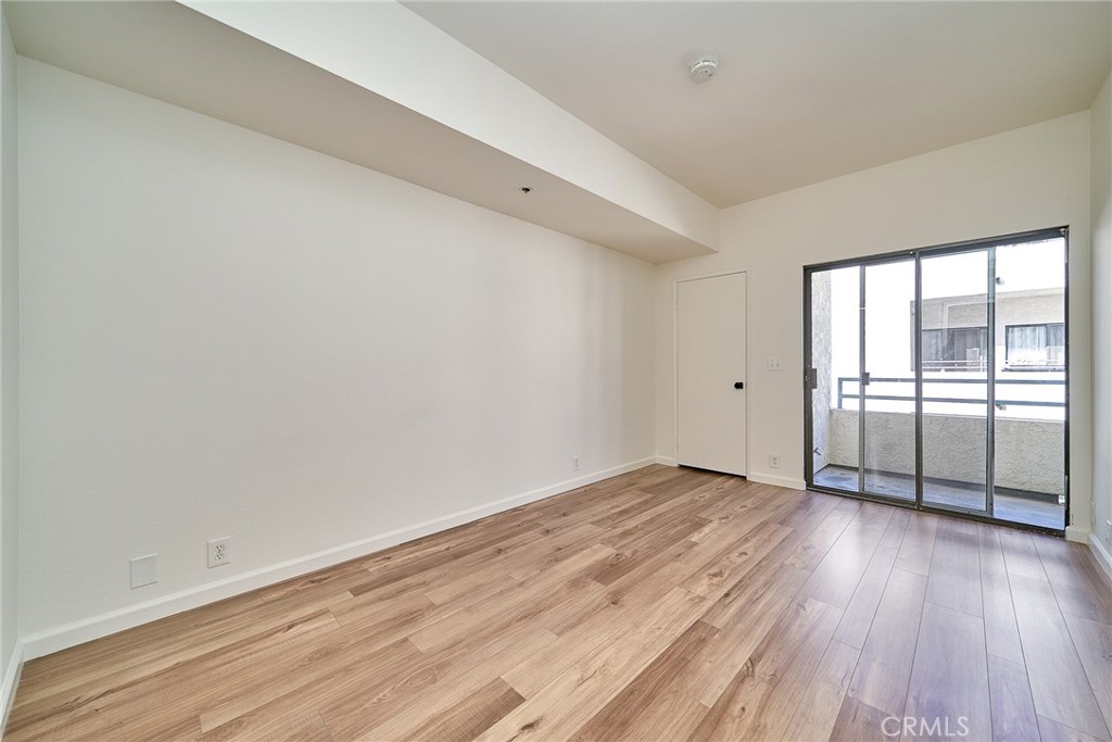 720 West 4th Street, Unit 305 Long Beach, CA 90802 - Photo 26 of 52 wooden floor in an empty room