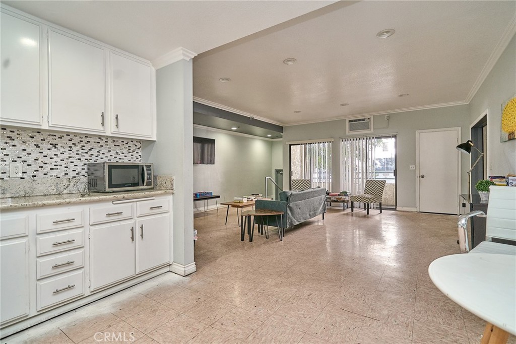 720 West 4th Street, Unit 305 Long Beach, CA 90802 - Photo 35 of 52 a living room with furniture and natural light