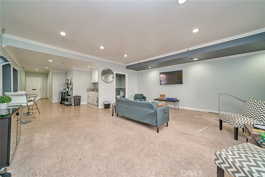 720 West 4th Street, Unit 305 Long Beach, CA 90802 - Photo 36 of 52 a living room with furniture and a flat screen tv