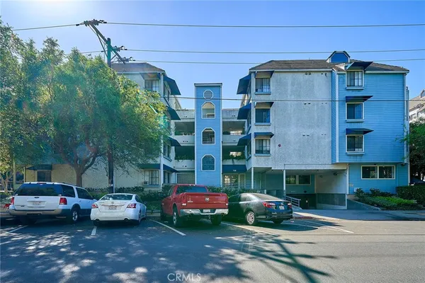 a front view of a building with parking space