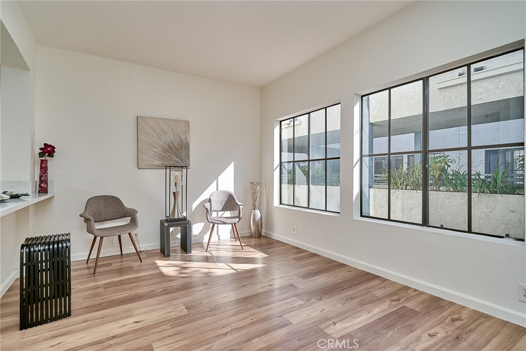 720 West 4th Street, Unit 305 Long Beach, CA 90802 - Photo 5 of 52 a living room with furniture and a large window