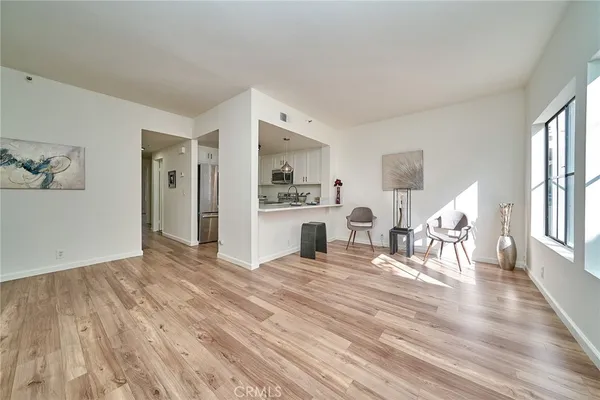 a view of kitchen with furniture and wooden floor
