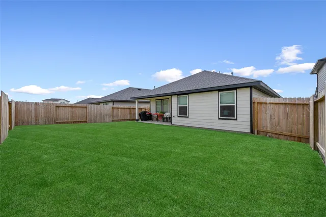 a backyard of a house with lots of green space