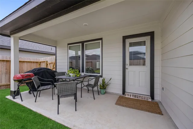 a view of living room filled with furniture and a potted plant