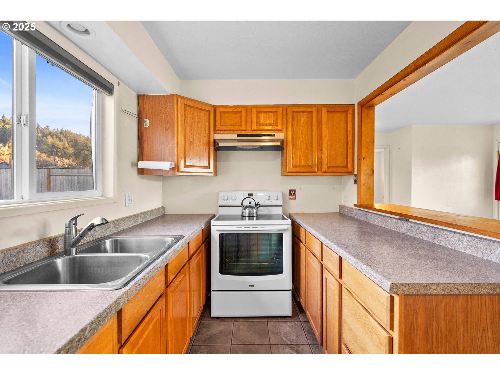 3875 East Amazon Drive Eugene, OR 97405 - Photo 17 of 33 a kitchen that has a sink and a stove